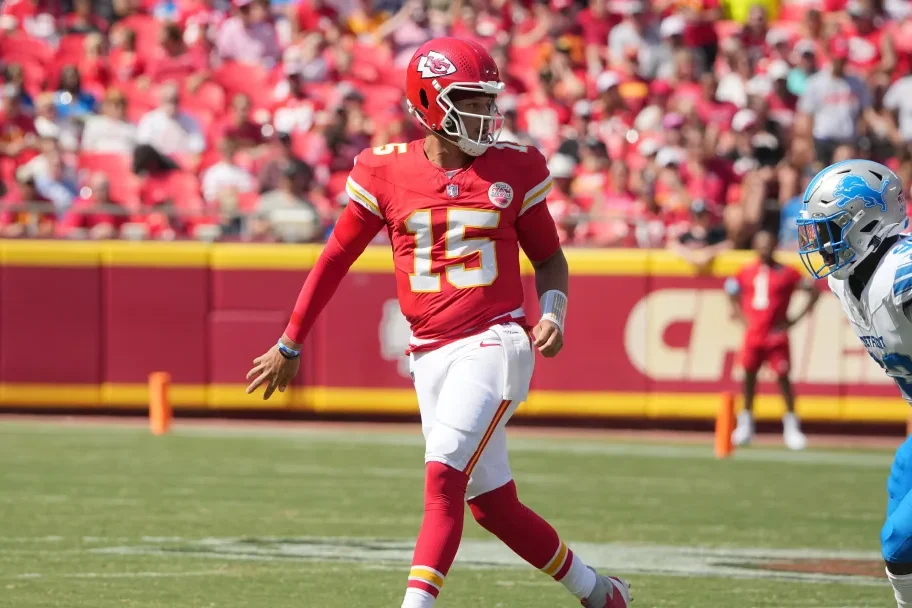 Kansas City Chiefs quarterback Patrick Mahomes (15) throws a behind-the-back underhand pass to tight end Travis Kelce (87) (not pictured) against the Detroit Lions during the first half at GEHA Field at Arrowhead Stadium. (Denny Medley/USA TODAY Sports)